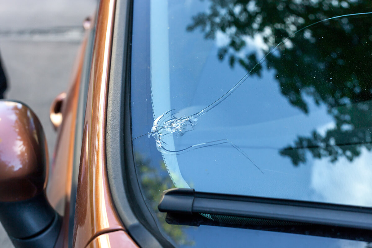 Broken car windshield glass from stone